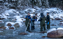 Students test water flow at the Shames Watershed