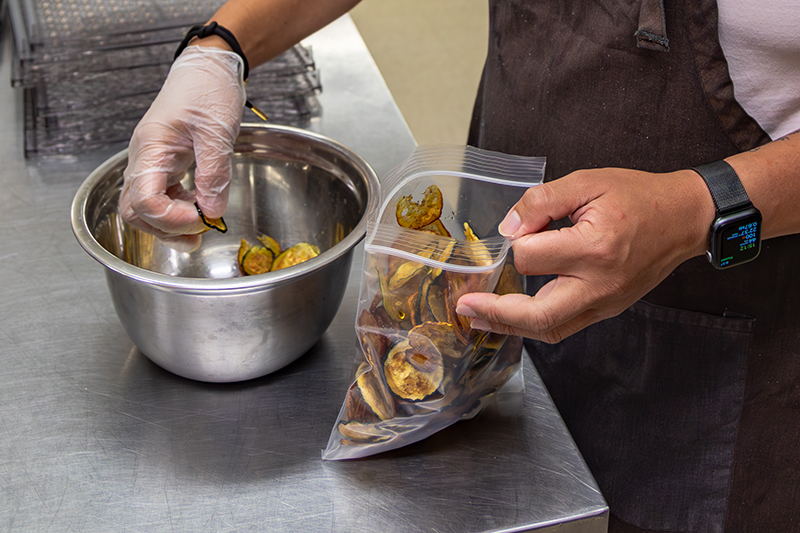 A Professional Cooking Student Packages Preserved Squash