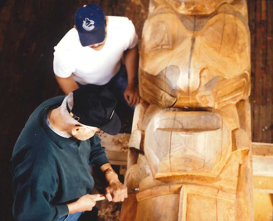 Carving the Education is Unity Pole