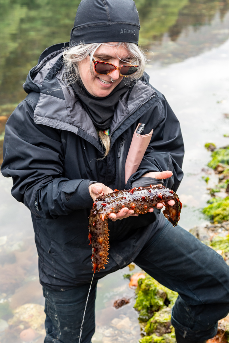Karen with a giant red sea cucumber.
