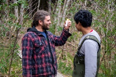 Two students smile about their findings in the Disturbed Environments Field School.